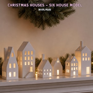 Peut inclure: Six modèles de maisons en céramique blanche avec des fenêtres et des portes découpées, éclairées de l'intérieur. Le texte CHRISTMAS HOUSES - SIX HOUSE MODEL 3D STL FILES est visible en haut. Ces structures présentent des formes variées.