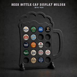 May include: A black beer mug-shaped bottle cap display holder with a handle and multiple circular cutouts. The holder contains various colourful metal bottle caps from brands like Corona, Bud Light, Guinness, Stella Artois, and others.