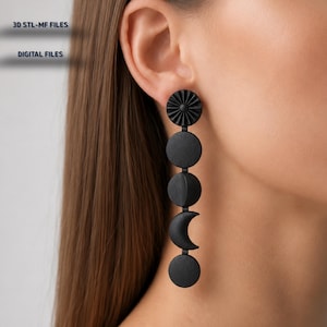 May include: A long, matte black earring featuring a vertical arrangement of five distinct shapes: a sunburst disc at the top, followed by a full circle, a partial crescent, a thin crescent moon, and a final circle at the bottom. Text reads 3D STL-MF FILES DIGITAL FILES.