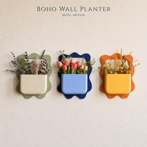 May include: Three wall planters with wavy frames in sage green, dark blue, and orange. The planters are cream, light blue, and yellow, holding lavender, pink tulips, and yellow wildflowers. Text reads BOHO WALL PLANTER 3D STL - MF FILES.