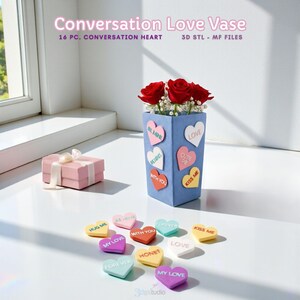 May include: A blue vase with heart-shaped conversation candies and red roses. The vase has heart-shaped stickers with phrases like "Be Mine" and "Love." A pink gift box with a white ribbon is on the left. The text "Conversation Love Vase" is at the top.