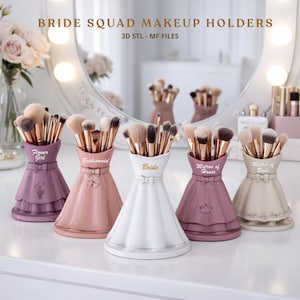 Könnte beinhalten: Ein Set aus drei Keramikbechern mit gesprenkelter, matter Oberfläche. Die Becher sind in den Farbtönen Creme, Hellgrau und Dunkelgrau gehalten. Jeder Becher hat ein schlichtes, modernes Design und einen abgerundeten Griff.