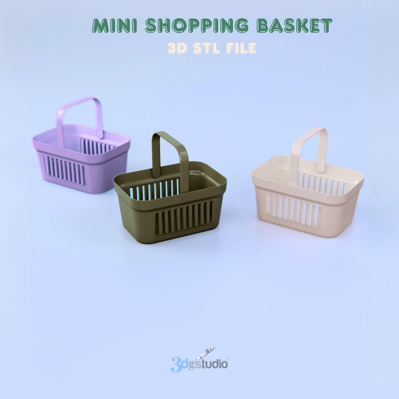 May include: Three mini shopping baskets in lavender, olive green, and beige. Each basket has a handle and vertical slots. The text "MINI SHOPPING BASKET" and "3D STL FILE" are at the top.