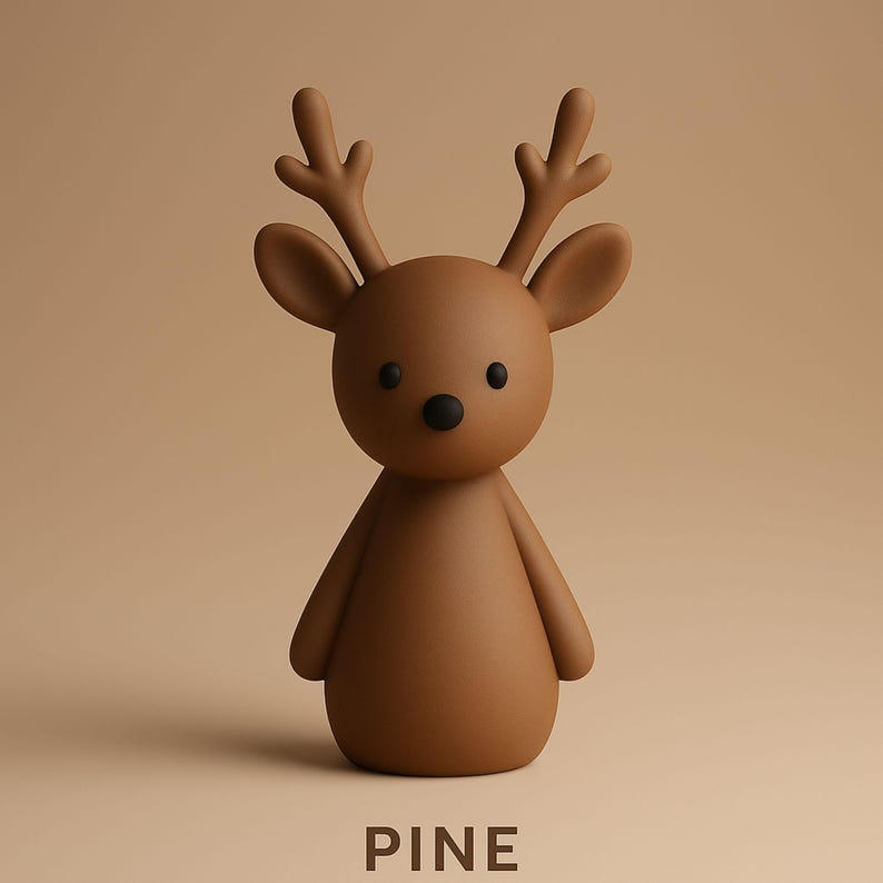 May include: A brown deer figurine with a rounded body, small antlers, and a black nose and eyes. The word "PINE" is printed in white at the bottom of the image. The deer is a decorative item.