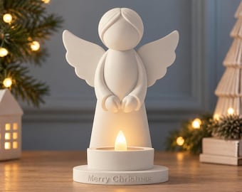 May include: A white angel figurine with outstretched wings and a smooth, rounded head. The base features a circular candle holder with a glowing LED light and the embossed text Merry Christmas. The top text reads ANGEL FIGURINE 3D STL FILES.
