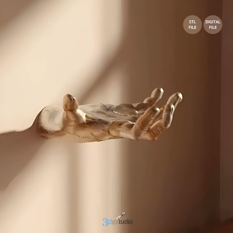 May include: A gold-colored, stylized hand sculpture with a textured surface, extending out from a wall. The hand is open and appears to be reaching out.