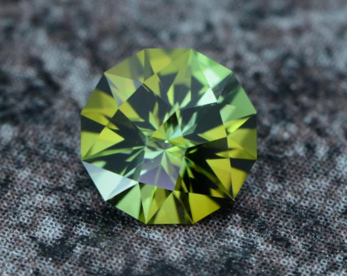 Tourmaline 0.62 carat olive green light green Congo natural untreated faceted, precision cut from Germany