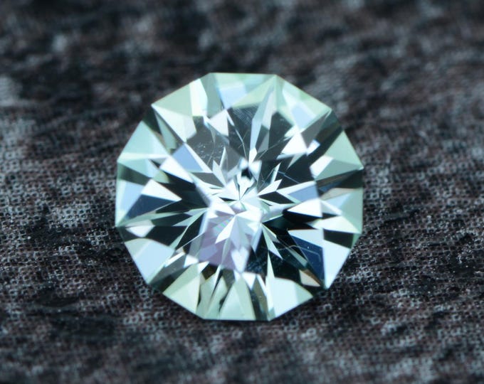 Tourmaline 0.84 carat greenish light blue from Congo naturally untreated faceted, precision cut from Germany