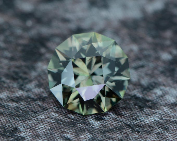 Sapphire 0.56 carat olive green-moss green Songea Tanzania natural untreated faceted, precision cut from Germany