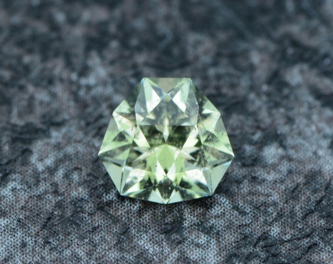 Tourmaline 0.69 carat light lime green Congo untreated faceted, precision cut from Germany