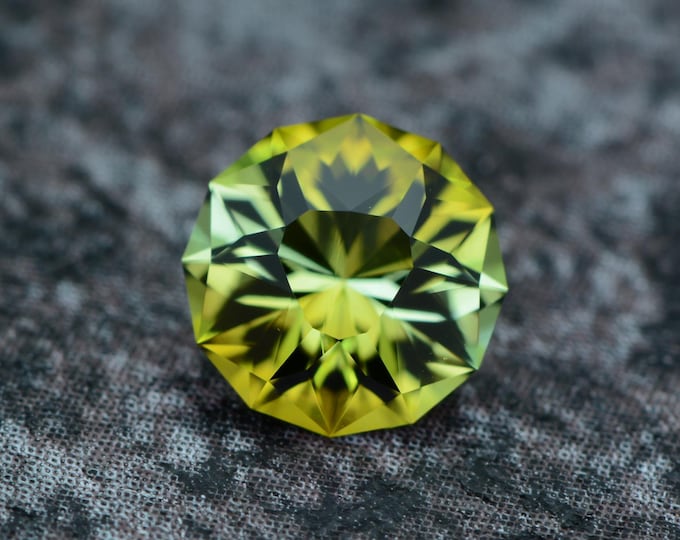 Tourmaline 0.91 carat olive green light green Congo natural untreated faceted, precision cut from Germany