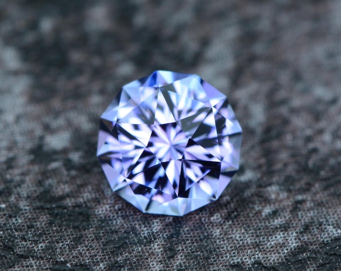 Tanzanite 0.74 carats light blue lavender Tanzanian naturally faceted, precision cut from Germany