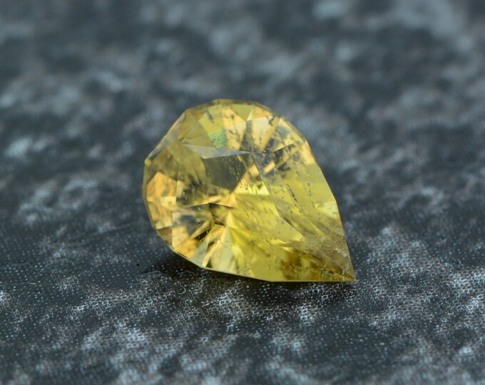 Tourmaline 0.82 carat yellow Mozambique untreated faceted, precision cut from Germany