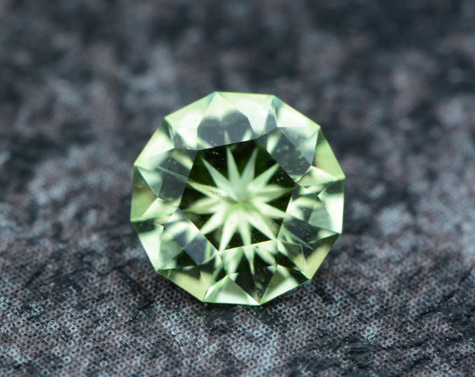 Peridot 0.88 carat light green from Tanzania naturally untreated faceted, precision cut from Germany