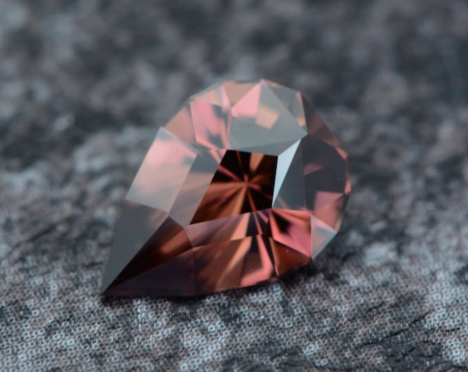 Zircon 1.89 carat burgundy red pink Tanzania Africa natural untreated faceted, precision cut from Germany
