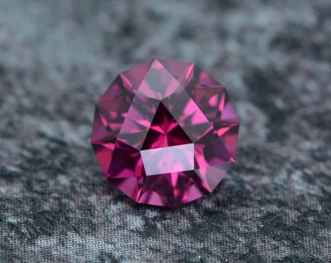Rhodolite garnet, 2.13 carats, pink berry, natural and untreated, from Tanzania, Africa; precision cut in Germany.