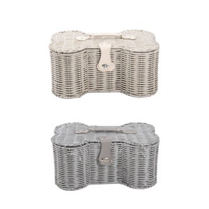May include: Two bone-shaped storage baskets made of woven material. The top basket is light beige with a matching handle and a central latch. The bottom basket is grey with a matching handle and a central latch. Both feature a lid and woven sides.