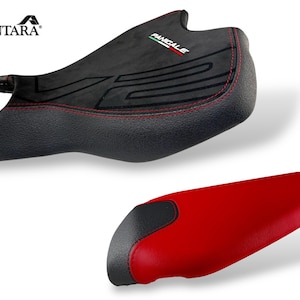 May include: Two motorcycle seats. The top seat is black with red stitching and the word "Pangale" and logo. The bottom seat is red with a black section at the front. The brand name "Alcantara" is in the top left corner.