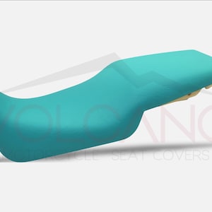 Può includere: Coprisedile per moto color turchese. La copertura è realizzata in un materiale morbido e resistente ed è progettata per adattarsi alla maggior parte dei sedili per moto.