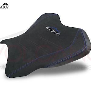 May include: Black motorcycle seat cover with blue stitching and the word "VOLCANO" embroidered in blue.