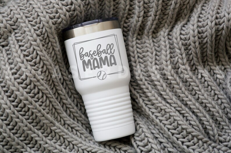 May include: White stainless steel tumbler with a black and white baseball graphic and the text "baseball mama".