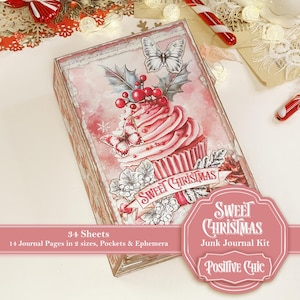 Peut inclure: Un kit de journal décoratif avec un motif de cupcake rose et blanc, des papillons et du houx. Les mots "Sweet Christmas" sont sur une bannière. Le kit comprend 34 feuilles et 14 pages de journal. Le journal est intitulé "Sweet Christmas Junk Journal Kit" par Positive Chic.