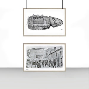 May include: Two black and white pencil drawings in frames. The top drawing is an aerial view of a stadium with the word "RICOH" on the side. The bottom drawing shows a crowd of people walking towards the stadium.