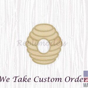 May include: Wooden cutout of a beehive with a circular opening in the centre. The cutout is light brown and has a wood grain texture. The text "We Take Custom Orders" is visible at the bottom of the image.