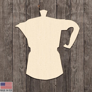 May include: A light beige wooden cutout of a stovetop espresso maker, also known as a Moka pot, against a dark wood grain background. The cutout is a simple silhouette with a handle and spout.