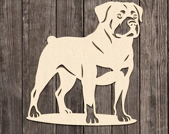 May include: A wooden Rottweiler dog silhouette. The dog is standing, facing right, with detailed cutouts defining its features. The silhouette is light brown against a dark wood grain background. The words "MADE IN USA" are in the lower left corner.