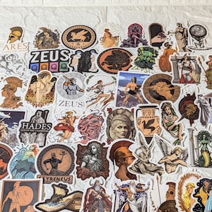 May include: A collection of assorted stickers featuring illustrations of Greek mythology figures, including Zeus, Hades, Ares, and Apollo. The designs incorporate various artistic styles, ranging from classical pottery motifs to modern graphic depictions.