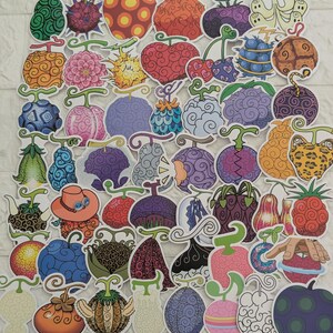 May include: A collection of numerous colourful stickers featuring various fantasy fruit designs with swirling patterns, spikes, and unique shapes. Each sticker displays a distinct, vibrant illustration of a fictional fruit, including shades of red, blue, purple, orange, and green.