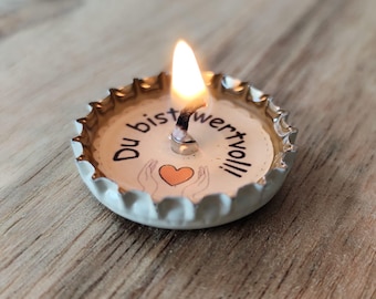 Hand-poured encouraging candle in a matchbox