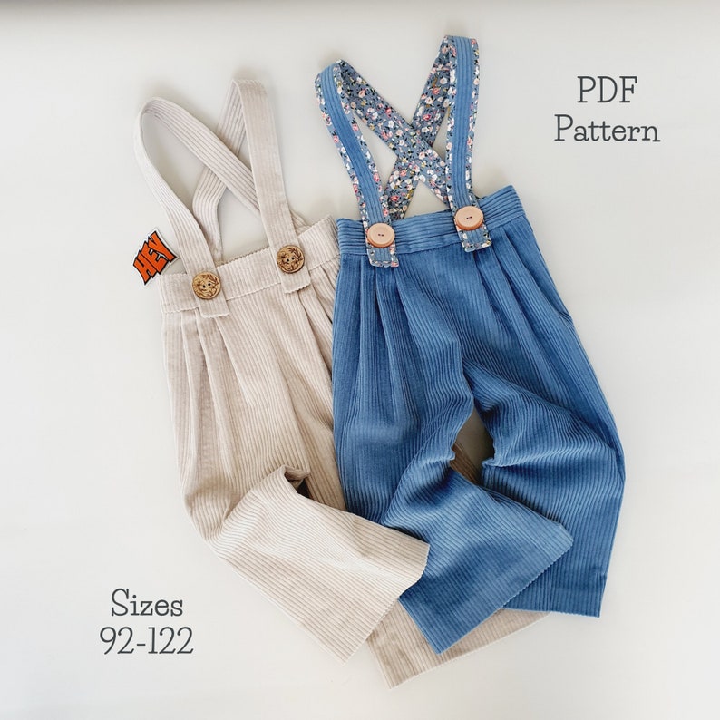 May include: Two pairs of corduroy overalls for children, one in beige and one in blue. The overalls have a floral print strap and button closures. The text "PDF Pattern" and "Sizes 92-122" is visible in the image.