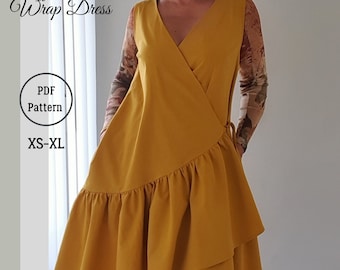 May include: A mustard yellow wrap dress with a ruffle hem. The dress has a V-neckline and a tie at the waist. The text "Ruffle Hem Wrap Dress" and "PDF Pattern XS-XL" is visible on the image.