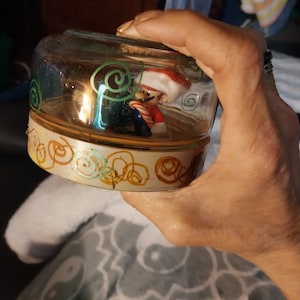 Mario in a christmas setting on glass bottle