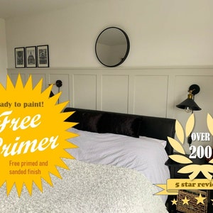 May include: A white bedroom with a bed, a mirror, and two wall sconces. The bed has a white duvet and a black headboard. The mirror is round and has a black frame. The wall sconces are black and have gold accents. The text "Ready to paint! Free Primer Free primed and sanded finish" is in a yellow starburst shape. The text "OVER 200 5 star reviews" is in a yellow wreath shape with five gold stars.