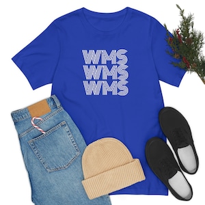 May include: A royal blue t-shirt featuring a white graphic design of the text "WMS" repeated three times in a stacked, retro style.