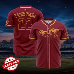 May include: Maroon baseball jersey with gold accents. The jersey features the text "Your Name" and the number "22" on the back. The front of the jersey displays "Team Name" and the number "22".