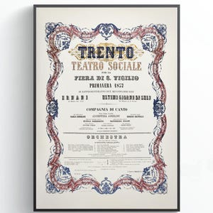 May include: A framed vintage poster with ornate borders and text. The poster, in a black frame, features the words "TRENTO TEATRO SOCIALE" and other Italian text, with decorative floral and scroll elements in red, blue, and gold.