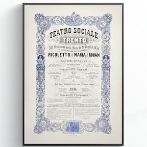 May include: Framed vintage poster for Teatro Sociale Trento, with elaborate blue and white decorative borders. The poster announces a performance of Rigoletto with Maria Rohan.