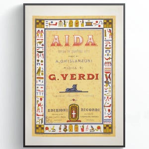 May include: Framed vintage poster for Verdi's opera, Aida. The poster features a yellow background with red and blue text, and Egyptian-inspired border designs. The title "AIDA" is prominently displayed at the top.