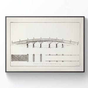 May include: A framed black and white architectural drawing of a bridge. The bridge has an arched design with multiple support pillars. The drawing includes detailed lines and shading, showcasing the bridge's structure. The frame is rectangular and black.