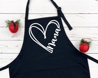May include: Black apron with a large white heart and the word "Mama" inside. The apron has a large pocket on the front.