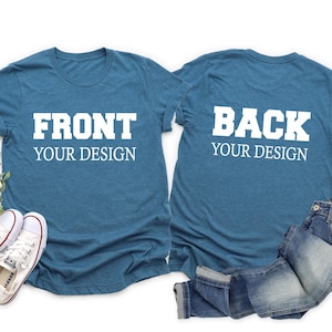 May include: Two blue t-shirts with white text. The front shirt says "Front Your Design" and the back shirt says "Back Your Design".