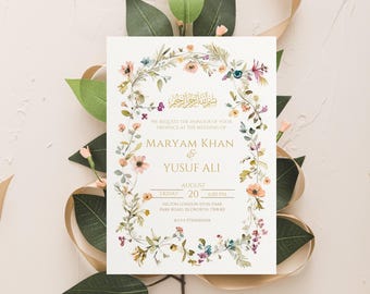 May include: A wedding invitation with a floral border and gold lettering. The invitation reads "We request the honor of your presence at the wedding of Maryam Khan & Yusuf Ali, Friday, August 20, 6:00 PM, Hilton London Syon Park, Park Road, Isleworth, TW7 8P, RSVP 0750000XXX".