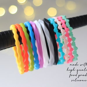 May include: A collection of colorful silicone bracelets with different patterns. The bracelets are made with high quality food grade silicone.