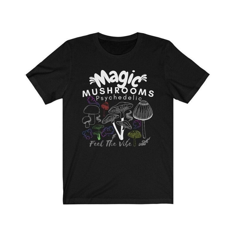 May include: Black t-shirt with a white graphic of mushrooms and the text "Magic Mushrooms Psychedelic Feel The Vibe".