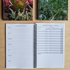 May include: A spiral bound notebook with a weekly habit chart and a notes section. The cover features a close-up of green moss with water droplets.