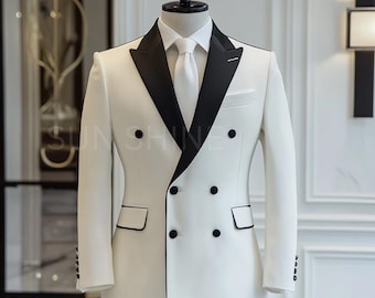 May include: A white double-breasted suit jacket with a black satin lapel and black buttons. The jacket has a slim fit and is made of a smooth fabric.
